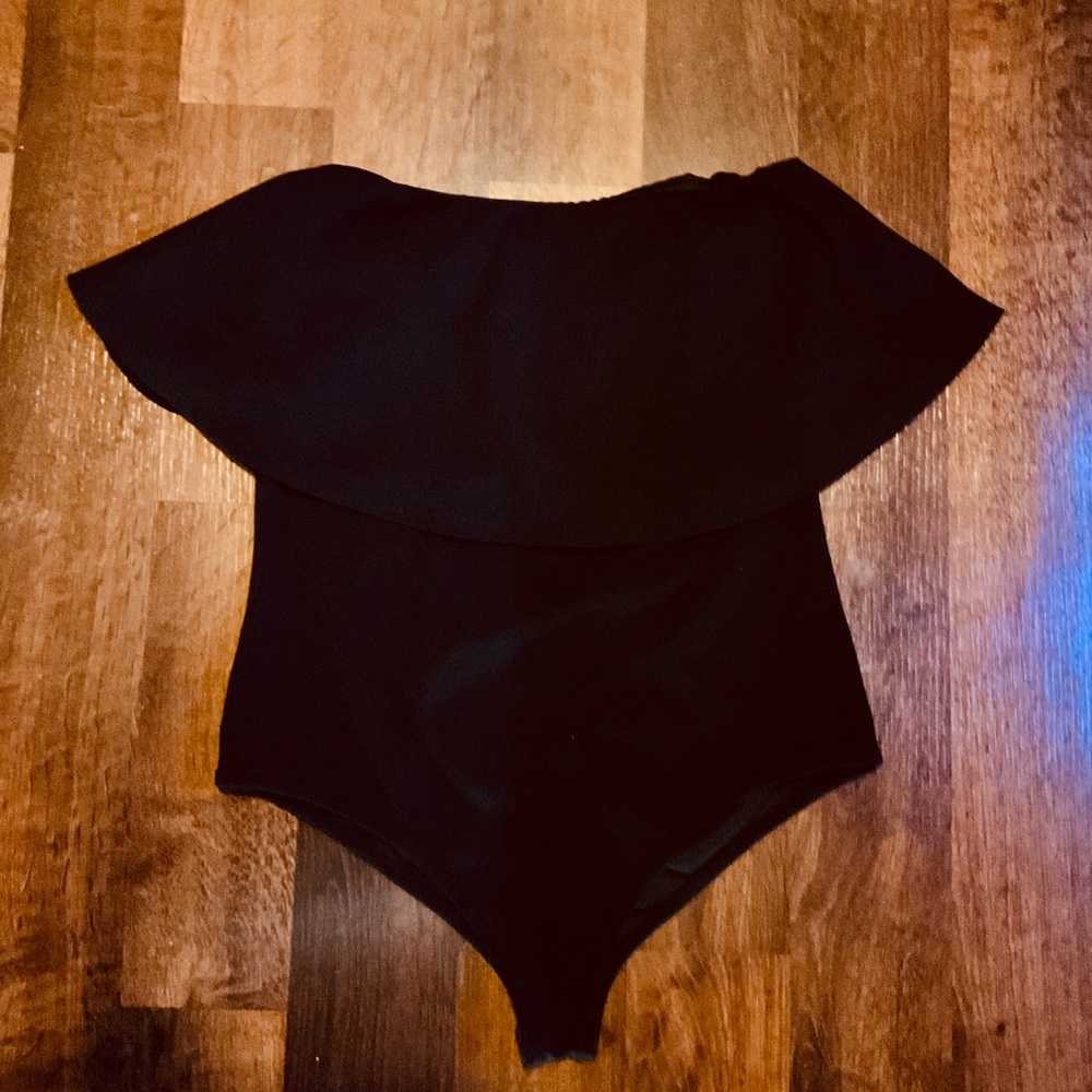 Black bodysuit off the shoulder